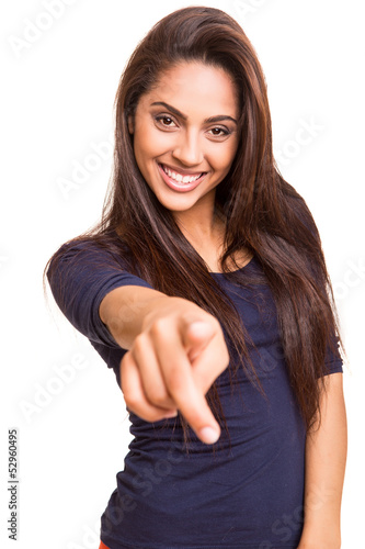 Photo: Smiling mix race woman pointing finger forward Smiling mix race woman pointing finger forward