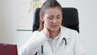 Female doctor having neck pain problem at work