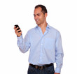 Hispanic adult man calling on cellphone