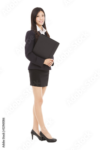 Photo: full length smiling businesswoman holding folder full length smiling businesswoman holding folder
