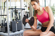 Girl working hard at gym