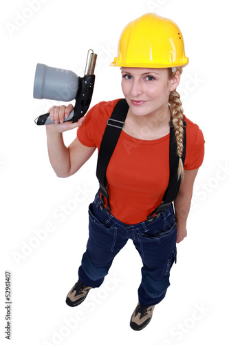Photo: Blond woman holding blow torch Blond woman holding blow torch