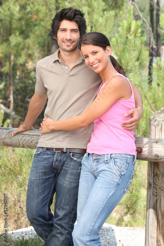 Photo: Happy couple stood in forrest Happy couple stood in forrest
