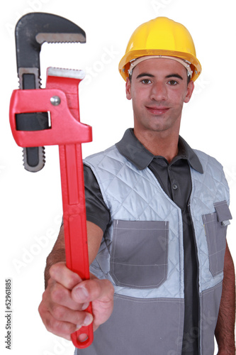 Photo: plumber showing spanner plumber showing spanner