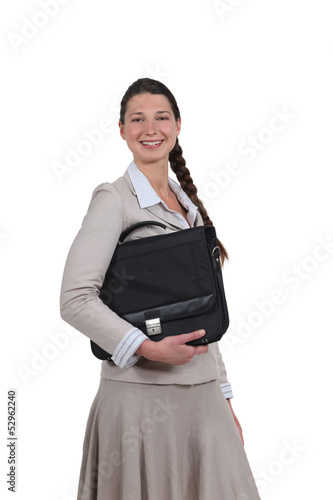 Photo: Young business professional carrying a briefcase Young business professional carrying a briefcase