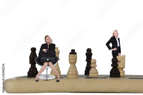 Photo: Two women on giant chessboard Two women on giant chessboard