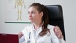 Happy relaxed female doctor having a break, tracking shot