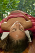 a woman relaxes after her shirodhara treatment