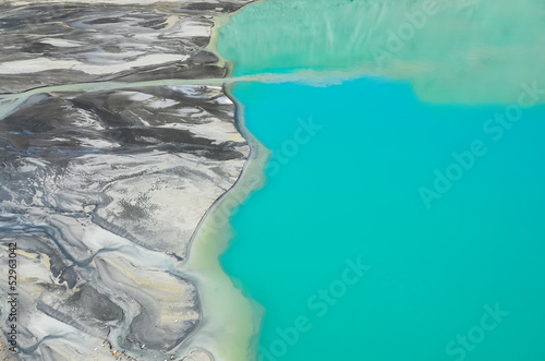 Photo: Detail aerial view of river flowing into mountain lake Detail aerial view of river flowing into mountain lake