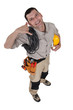 Photo: Electrician making a phone gesture Electrician making a phone gesture