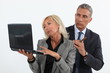 Photo: businessman with cigar standing near colleague businessman with cigar standing near colleague