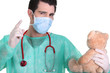 Foto: Doctor holding teddy bear Doctor holding teddy bear