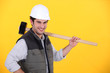 Photo: Happy builder carrying sledge-hammer Happy builder carrying sledge-hammer