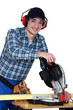 Tradesman using a circular saw