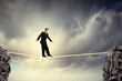 Photo: Businessman balancing on rope Businessman balancing on rope