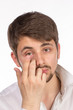 Closeup view of a man's brown eye while inserting a corrective c