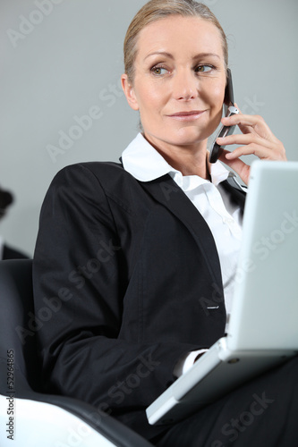 Photo: Businesswoman making a call Businesswoman making a call