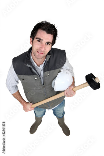 Photo: Tradesman holding a mallet Tradesman holding a mallet