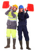 Foto: A team of tradespeople yelling into pylons A team of tradespeople yelling into pylons