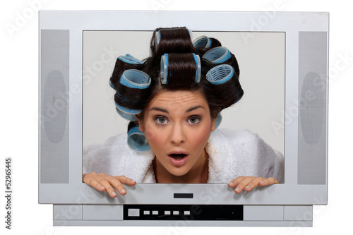Photo: woman in tv set with hair curlers woman in tv set with hair curlers