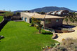 Mediterranean villa with lawn and blue sky