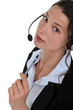 Photo: A businesswoman with a headset on. A businesswoman with a headset on.