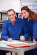 Photo: Tradespeople working together in the office Tradespeople working together in the office
