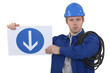 Photo: Electrician holding road sign Electrician holding road sign