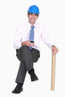 Photo: Engineer sitting on an invisible stool Engineer sitting on an invisible stool