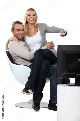 Photo: Couple channel surfing Couple channel surfing
