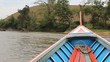 Long Tail Boat On River In Rural Thailand