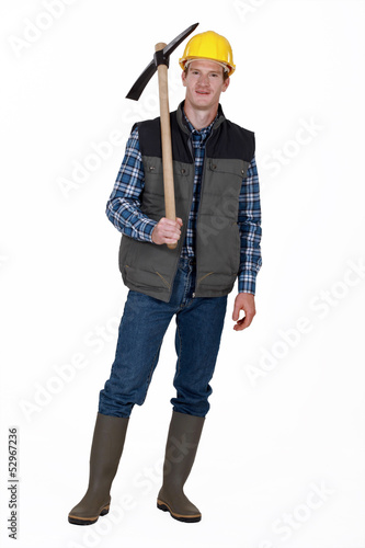 Photo: Man stood with pick-ax Man stood with pick-ax