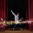 Photo: Artist play guitar on stage with musical notes Artist play guitar on stage with musical notes