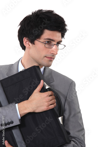 Photo: Man clutching a briefcase Man clutching a briefcase