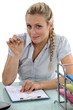 Photo: Businesswoman holding a pen Businesswoman holding a pen