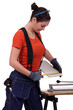 Woman cutting a tile