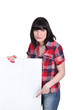 brown-haired woman pointing white panel
