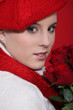 Photo: Woman in a red beret with red roses Woman in a red beret with red roses
