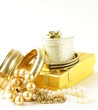 gold and pearl jewelry, gift boxes on a white background