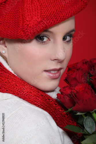 Photo: Woman in a red beret with red roses Woman in a red beret with red roses