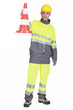 Photo: Traffic guard holding a pylon Traffic guard holding a pylon