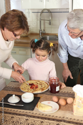 Photo: Family preparing pancakes Family preparing pancakes