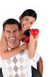 Photo: Happy couple with red heart Happy couple with red heart