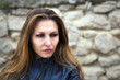 Woman on a brick background