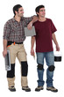 Two men about to plaster
