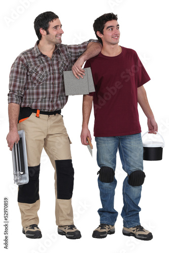 Photo: Two men about to plaster Two men about to plaster