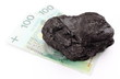 Large coal lump with money on white background Large coal lump with money on white background
