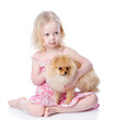 girl and puppy. looking at camera. isolated on white background