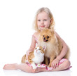 girl playing with pets - dog and cat. looking away. isolated 
