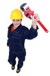 Photo: Female worker with an adjustable pipe wrench Female worker with an adjustable pipe wrench